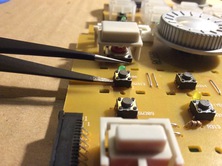 stick a tweezer or very small screwdriver between circuit board and switch...