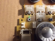 put in switches in the cleaned wholes, they should sit plain and tight on circuit board